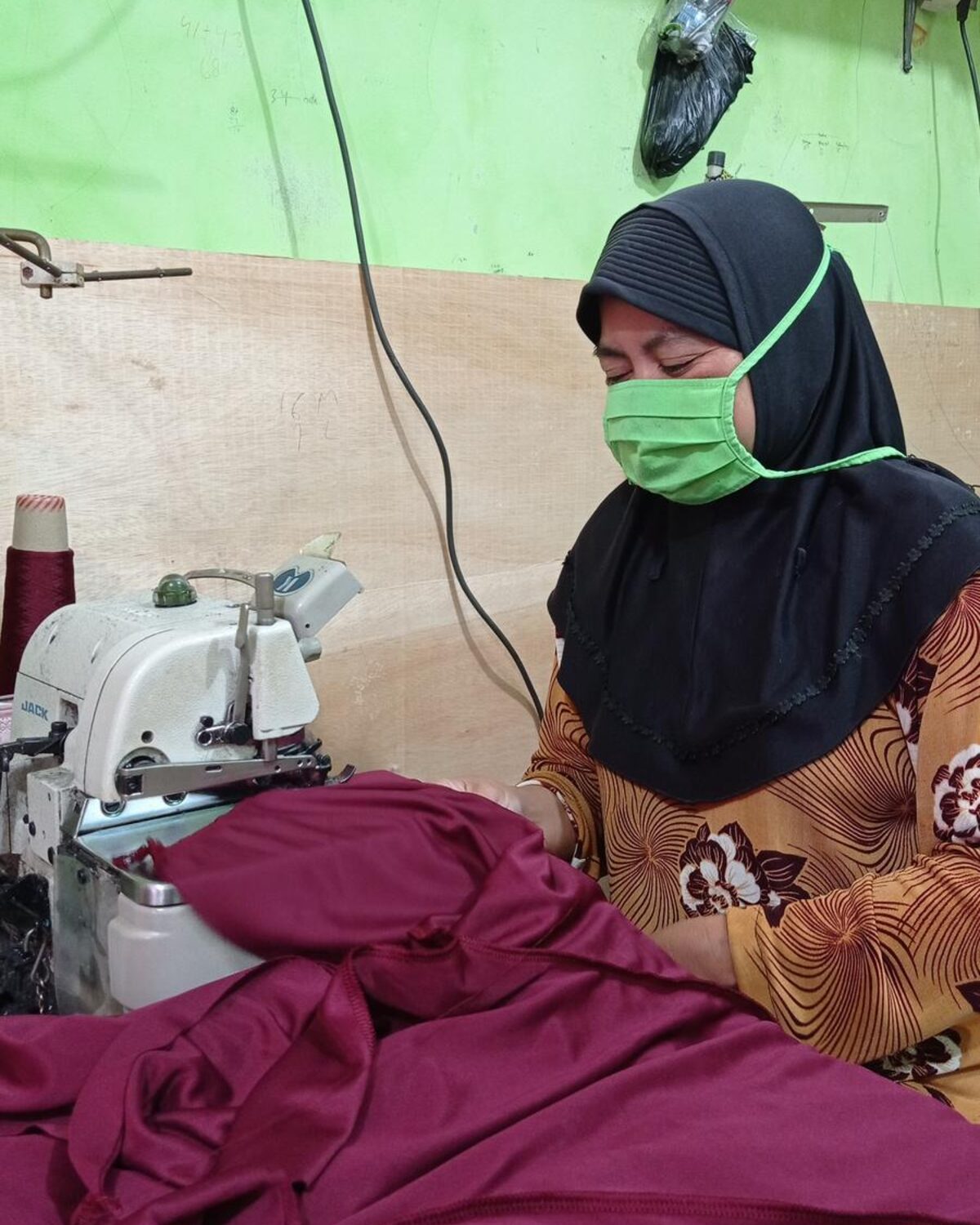 Garment manufacturing: sewing station on the production floor