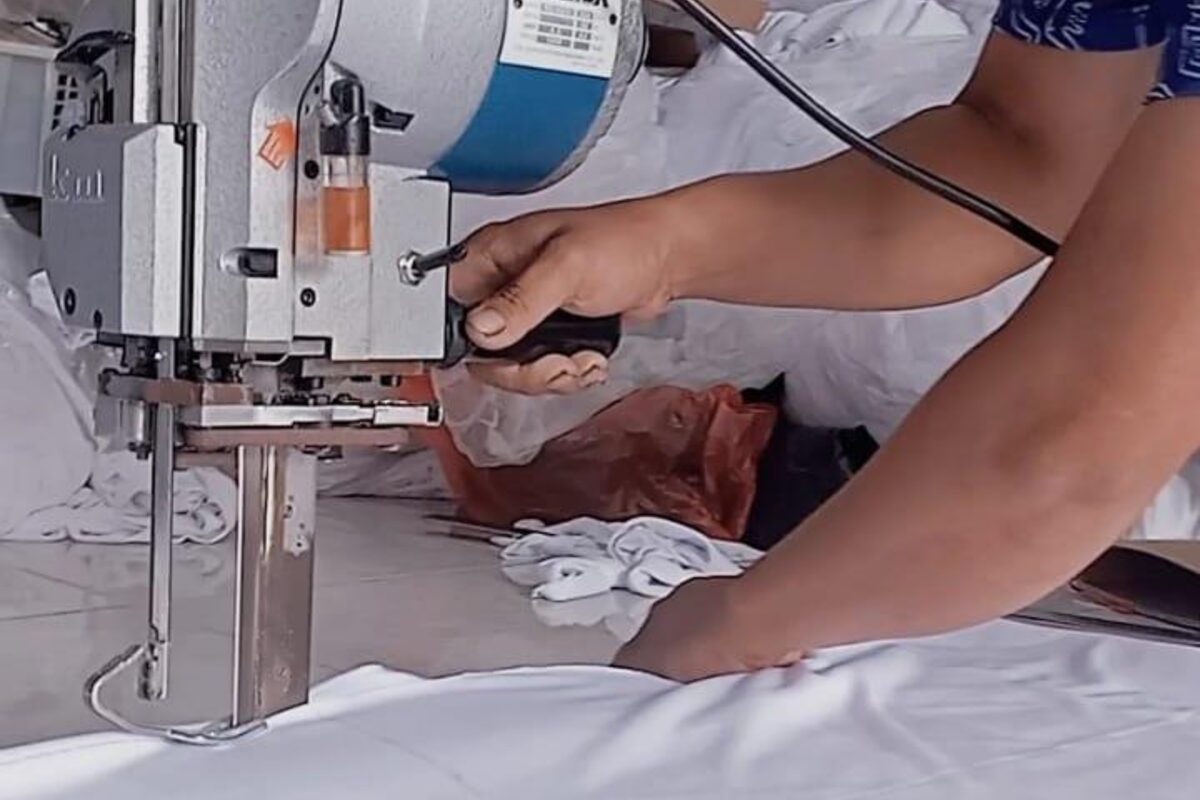 Fabric laid out and cut to pattern on the cutting table