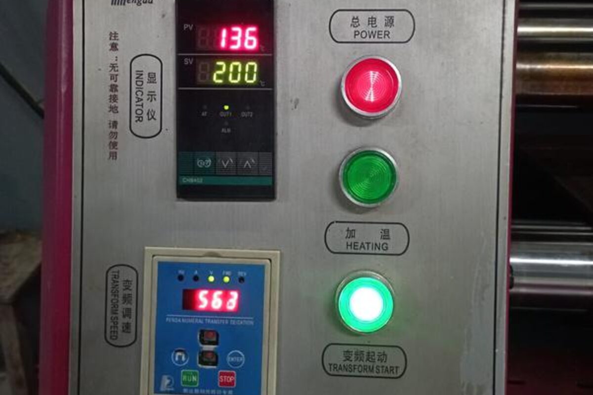 Heat transfer press finishing a printed panel